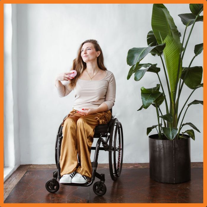 woman in wheelchair smiling