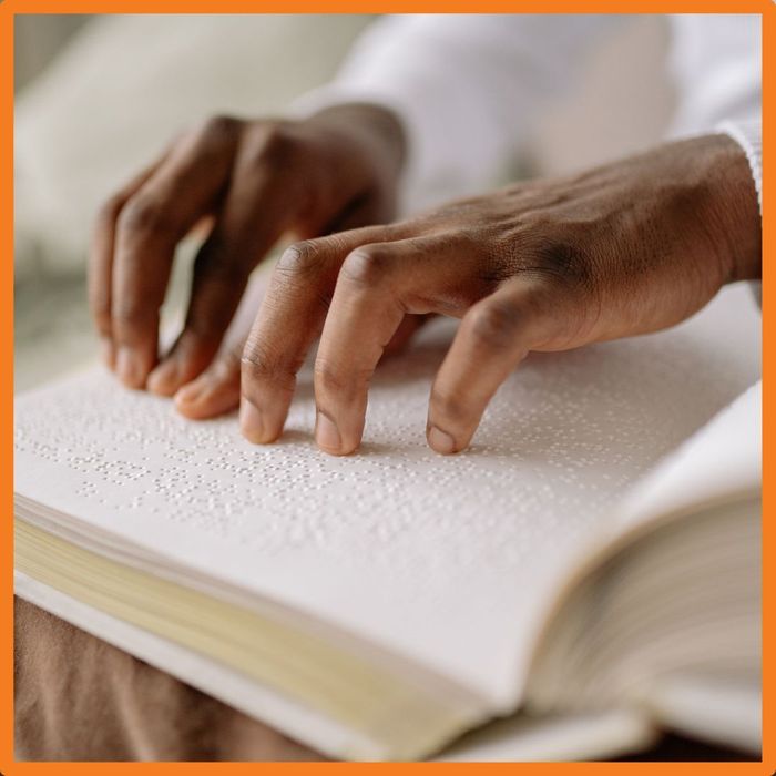 person reading braille