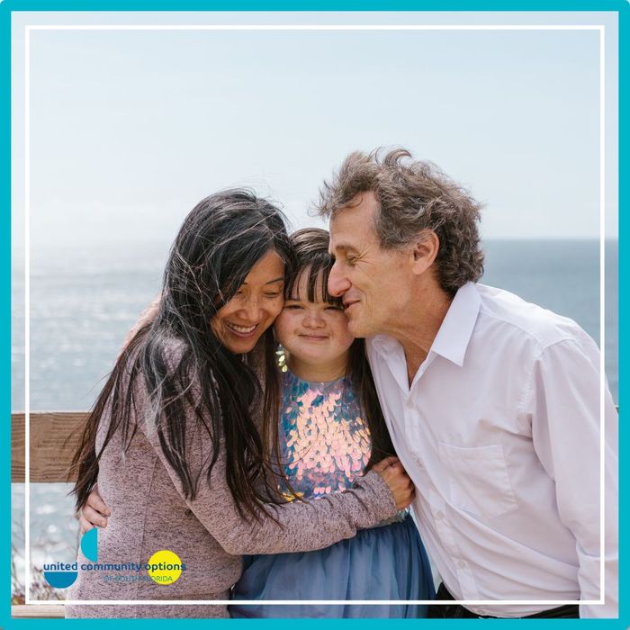 parents hugging their daughter Importance of Community.jpg