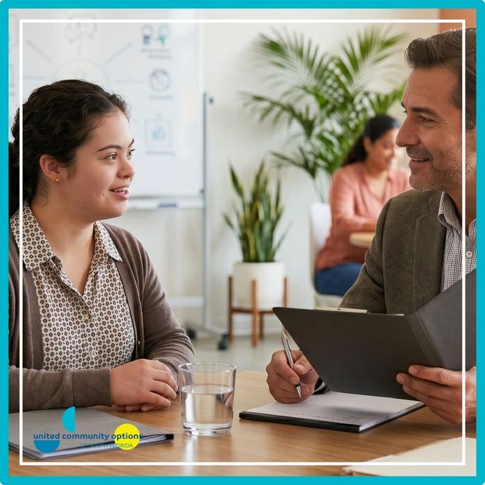 A professional career counselor conducting a mock interview with a young woman