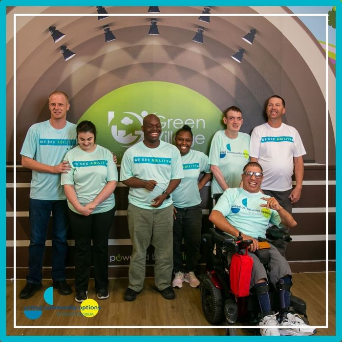 Adults with disabilities smiling together
