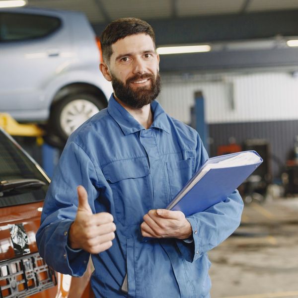 auto technician giving thumbs up