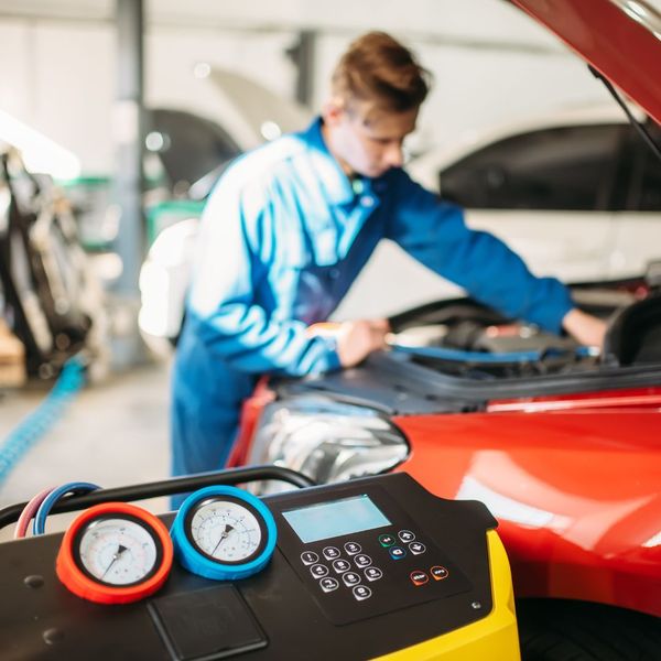 technician repairing car