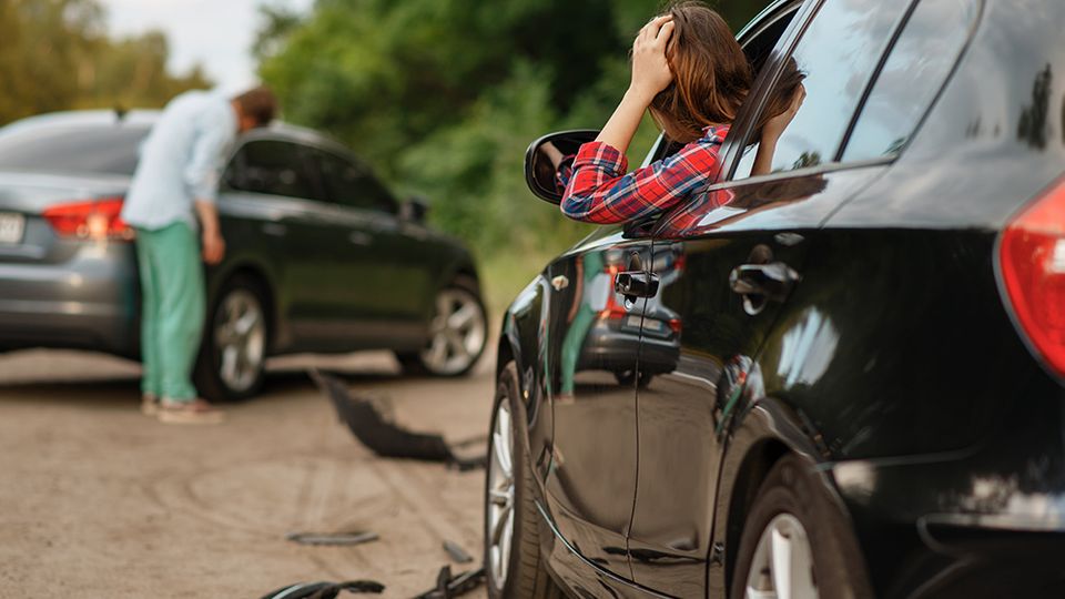 image of a woman in a car accident