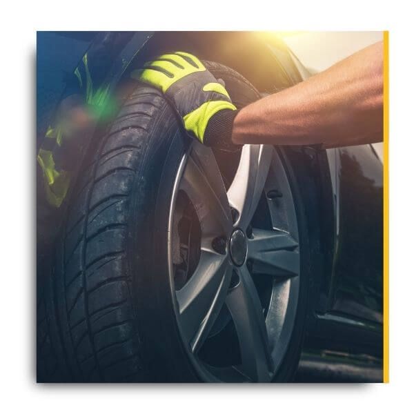 mechanic fixing a tire