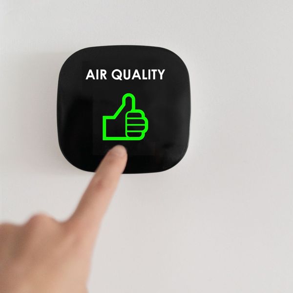 Indoor 'Air Quality' sign with green thumbs up icon