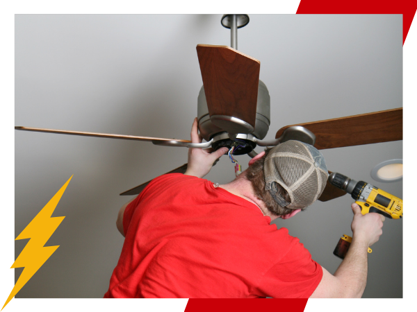 technician working on a ceiling fan