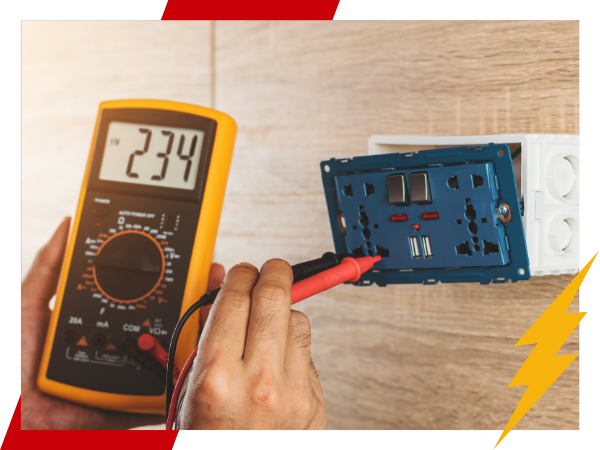 Person testing a multimeter on a 240 outlet