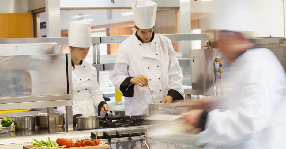 chefs working in a busy kitchen