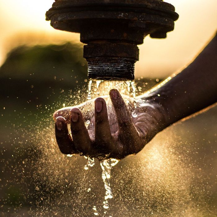 hand under running faucet, clean water concept hand under running faucet, clean water concept