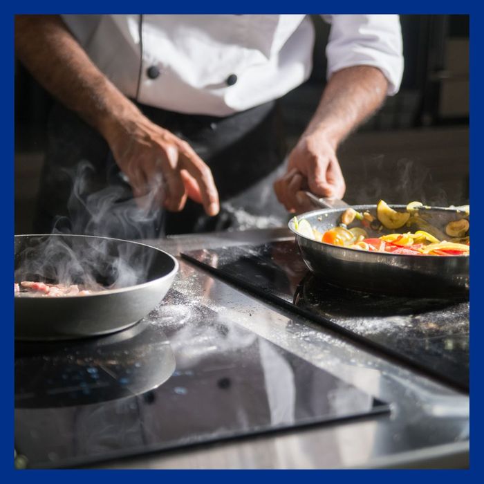 Chef Cooking Food in Two Pans What Happens If You Don%E2%80%99t Clean Your Grease Trap1.jpg