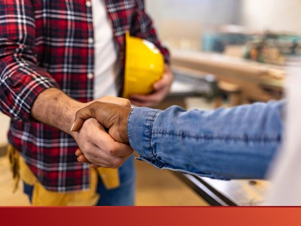 Image of contractor and a client shaking hands