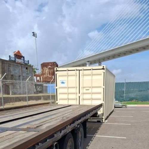 a shipping container next to trailer