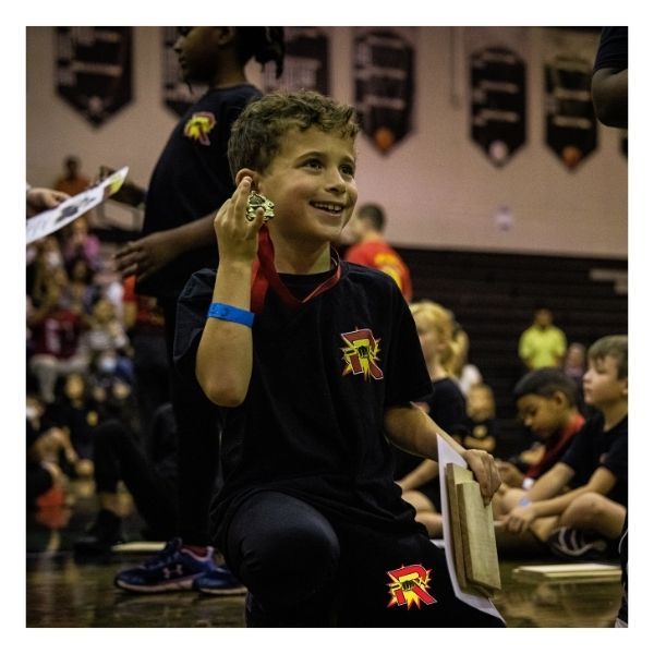 kid receiving a medal for karate