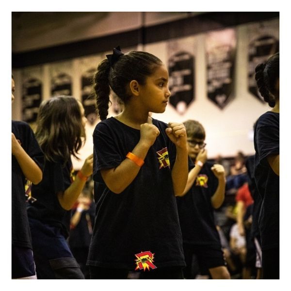 young girl focusing in karate class