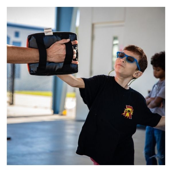 boy practicing martial arts after school