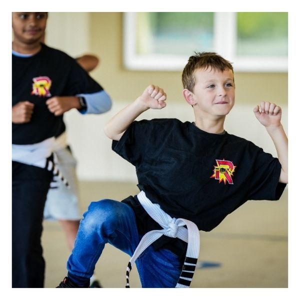 smiling child practicing martial arts