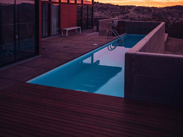 backyard pool at sunset