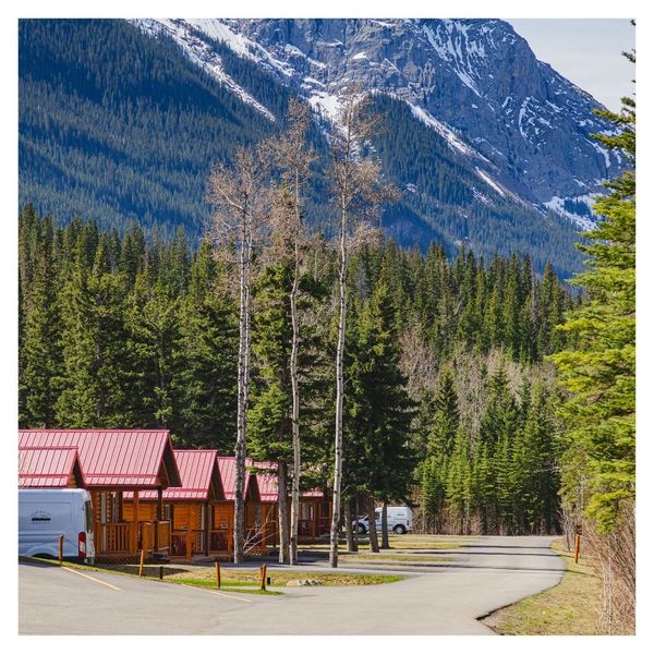 Jasper East cabins exterior with mountain behind them