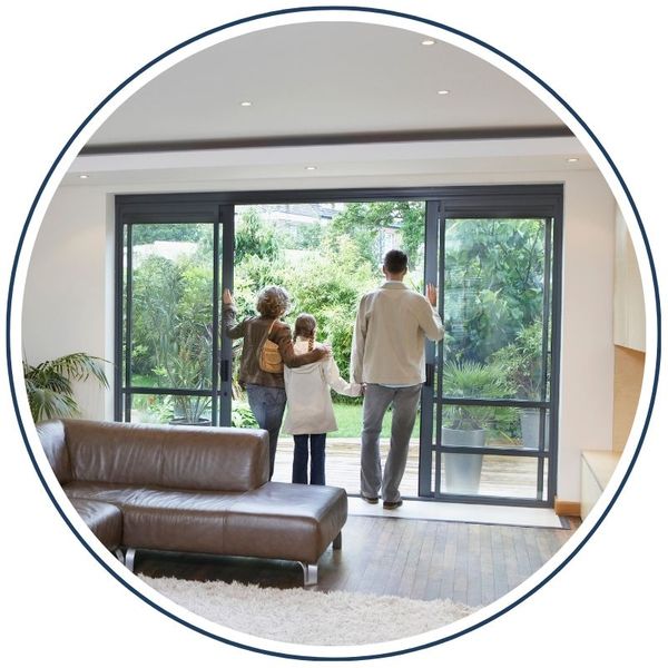 family looking through patio door