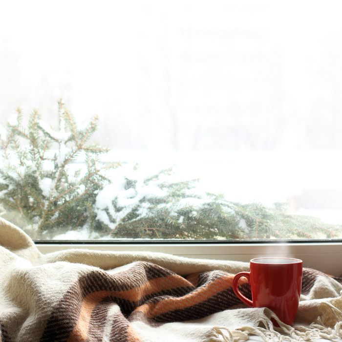 blanket next to snowy window