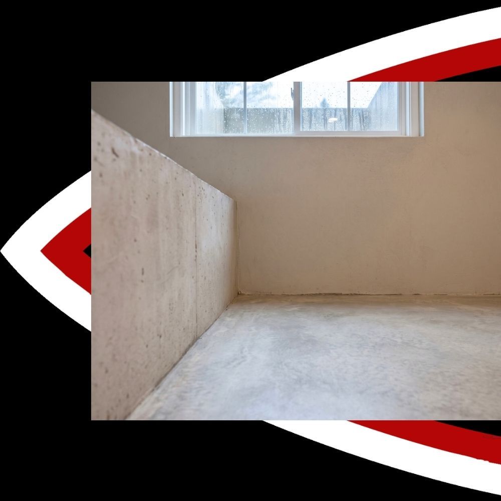 Clean and dry basement foundation wall and floor under a window