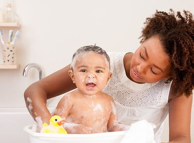 Image of a baby getting a bath