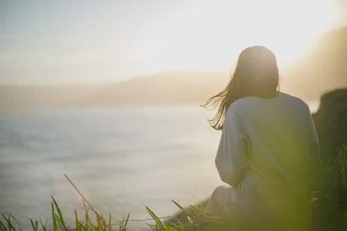 Image of a girl sitting outside