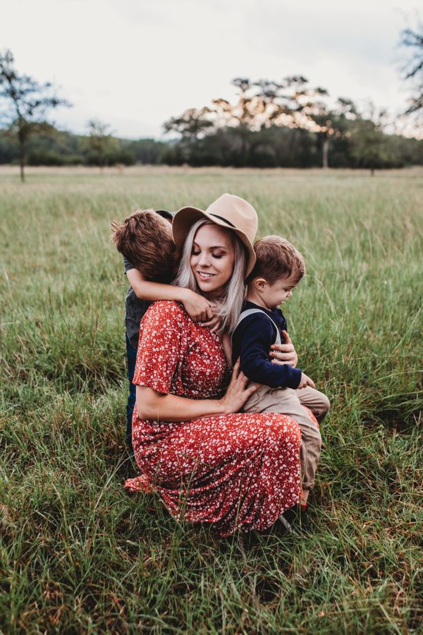 girl with two sons in field .jpg