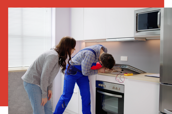 Man repairing a stove top