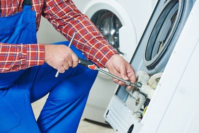 repairing washing machine interior