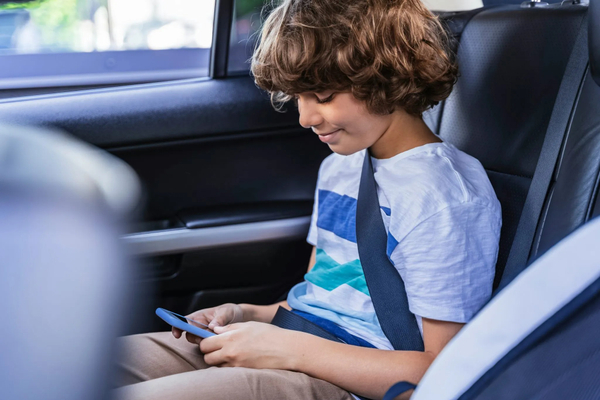 image of a kid on a phone