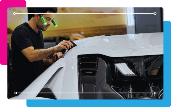 Paint protector being applied to a car