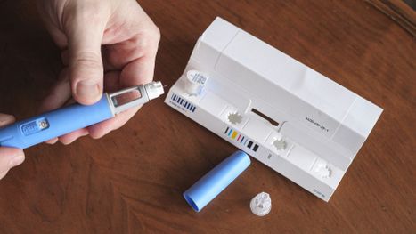 Person opening a semaglutide packaging. 
