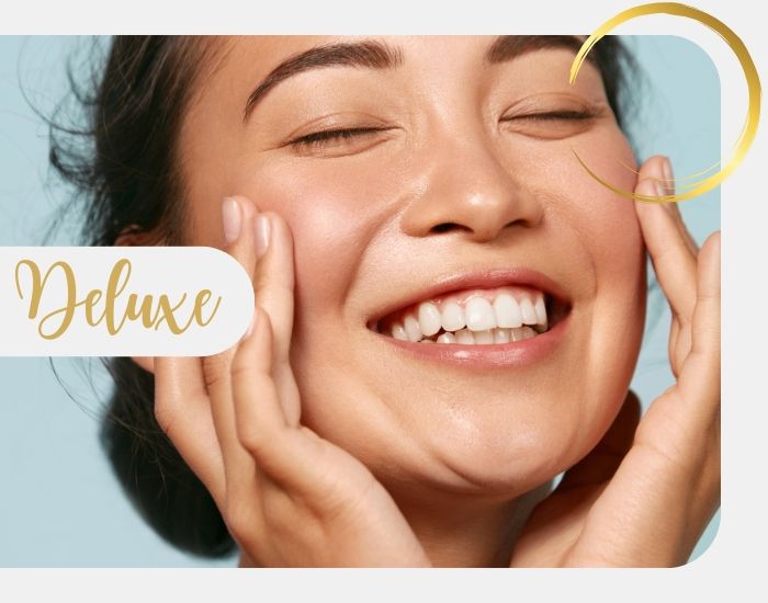 Delux Hydrafacial with a smiling woman