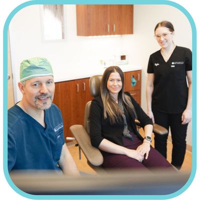 doctor and hygienist speaking with patient