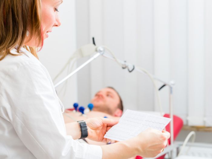 doctor conducting a cardiac test on a patient