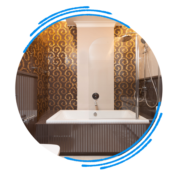 A luxury bathtub with a showerhead and a half panel of glass