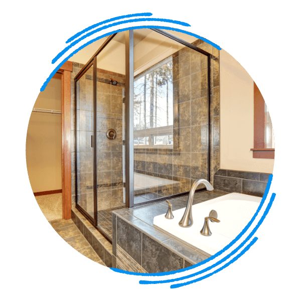 A newly installed, modern bathtub and glass shower in a bright, clean bathroom. clinch.png