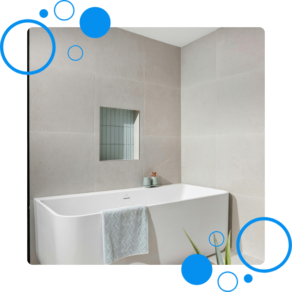 A rectangular bathtub sitting in the corner of a bathroom