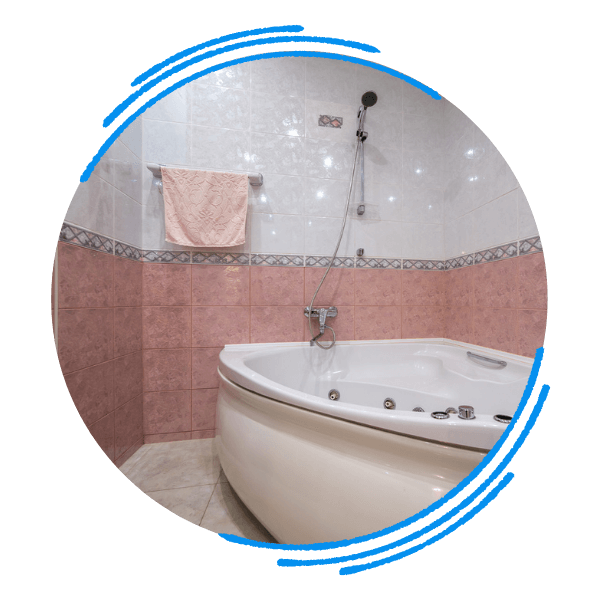 sleek, luxurious, newly remodeled bathroom featuring a spacious glass shower enclosure and a modern freestanding bathtub. candler3.png