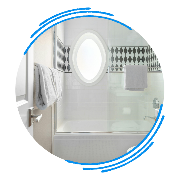 Classically restored tub and shower combo with exquisite tiling and a sliding glass door