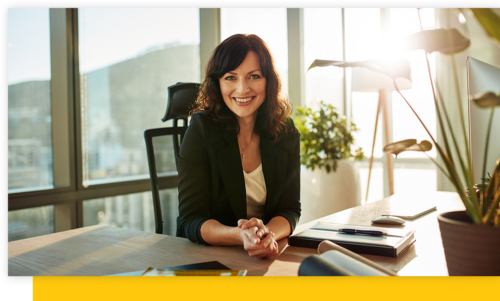 A businesswoman sitting at her desk in her office