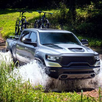 Truck driving through water. 