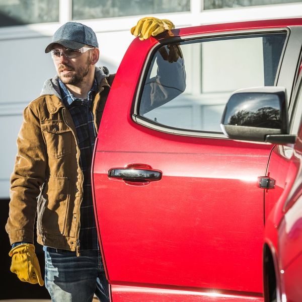 man next to truck door