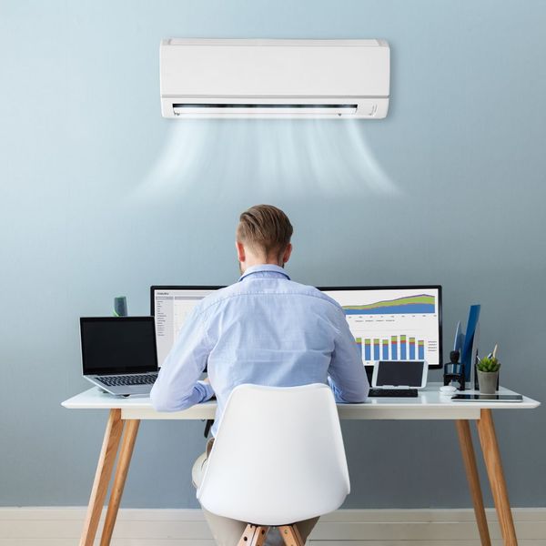 man enjoying AC unit