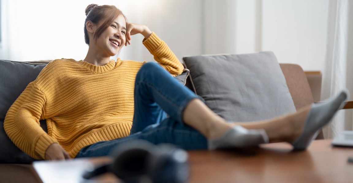 Smiling woman sitting on a couch