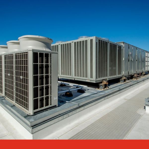 A large set of industrial HVAC equipment on a commercial roof.