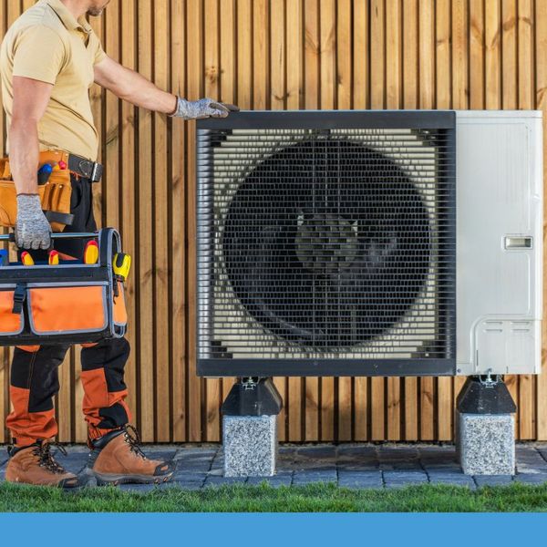 HVAC tech leaning against an outdoor unit