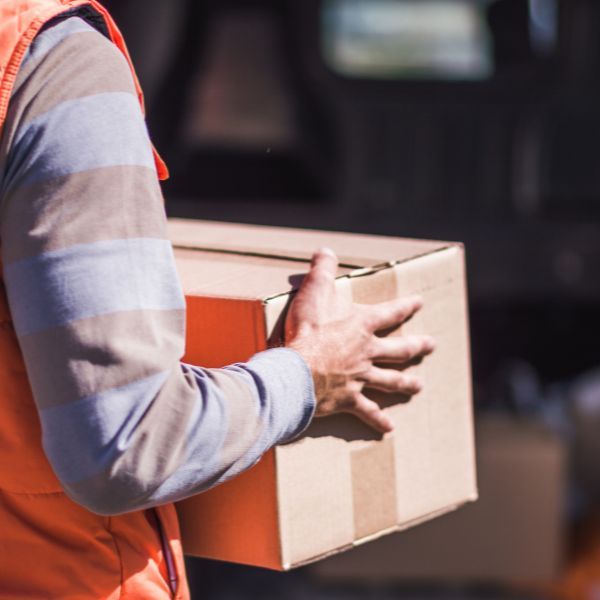 A person delivering a box
